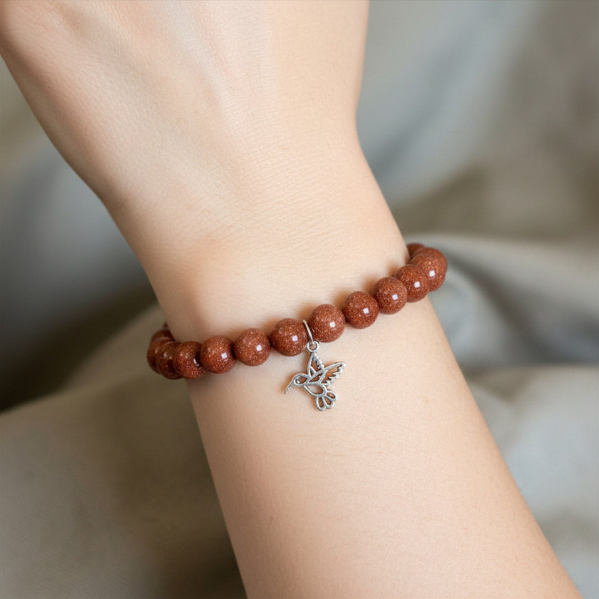 Pulsera Goldstone con Charm Colibrí