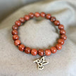 Pulsera Goldstone con Charm Colibrí